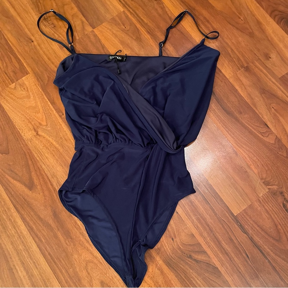 Blue bodysuit with a deep V neckline